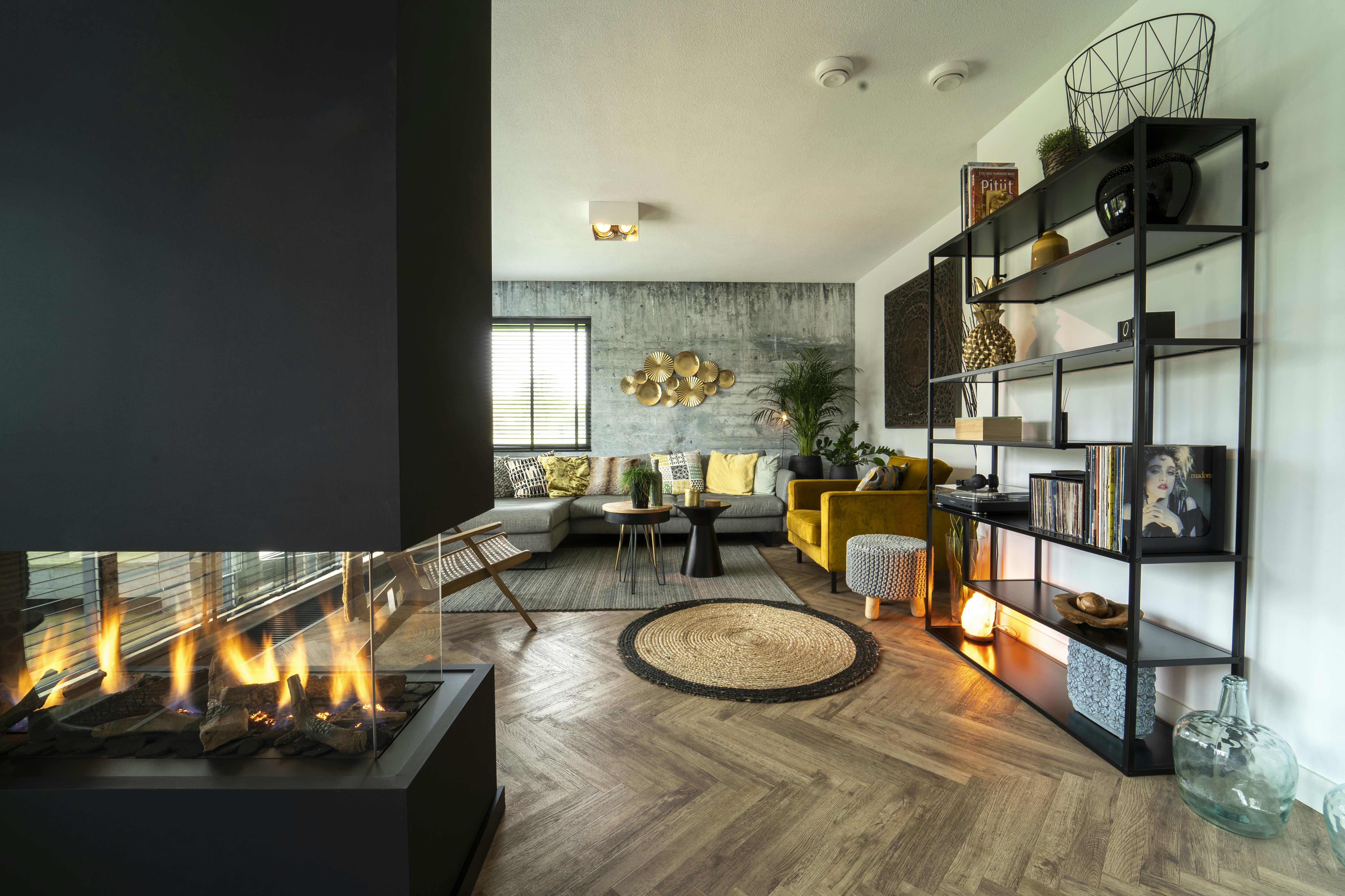 Fireplace with logs burning brightly.