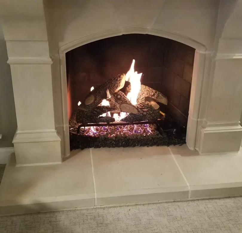 A warm fire burning in a fireplace, creating a welcoming atmosphere i